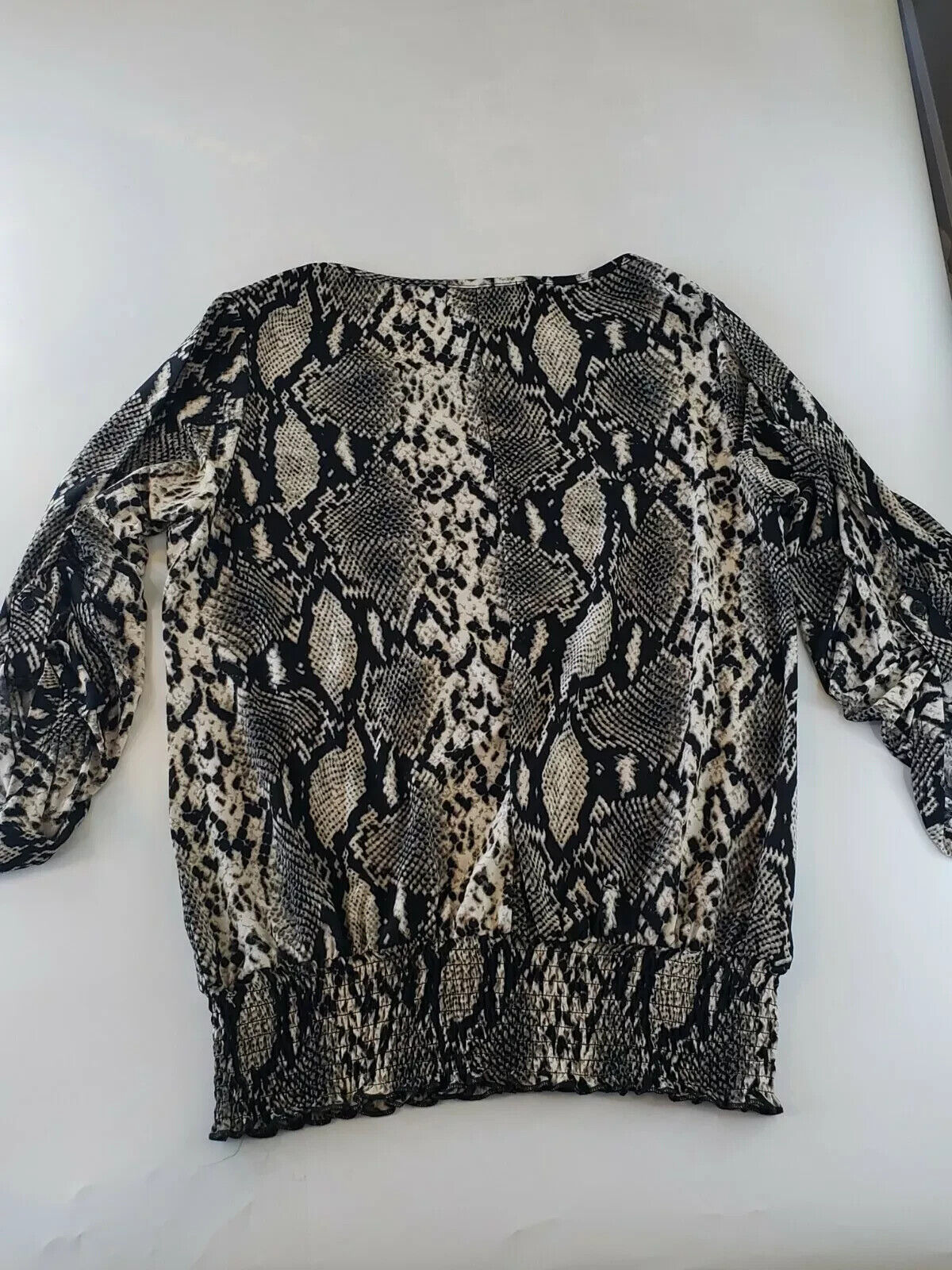 Snakeskin print blouse by isabella rodriguez. Ruched/elastic waist size Small